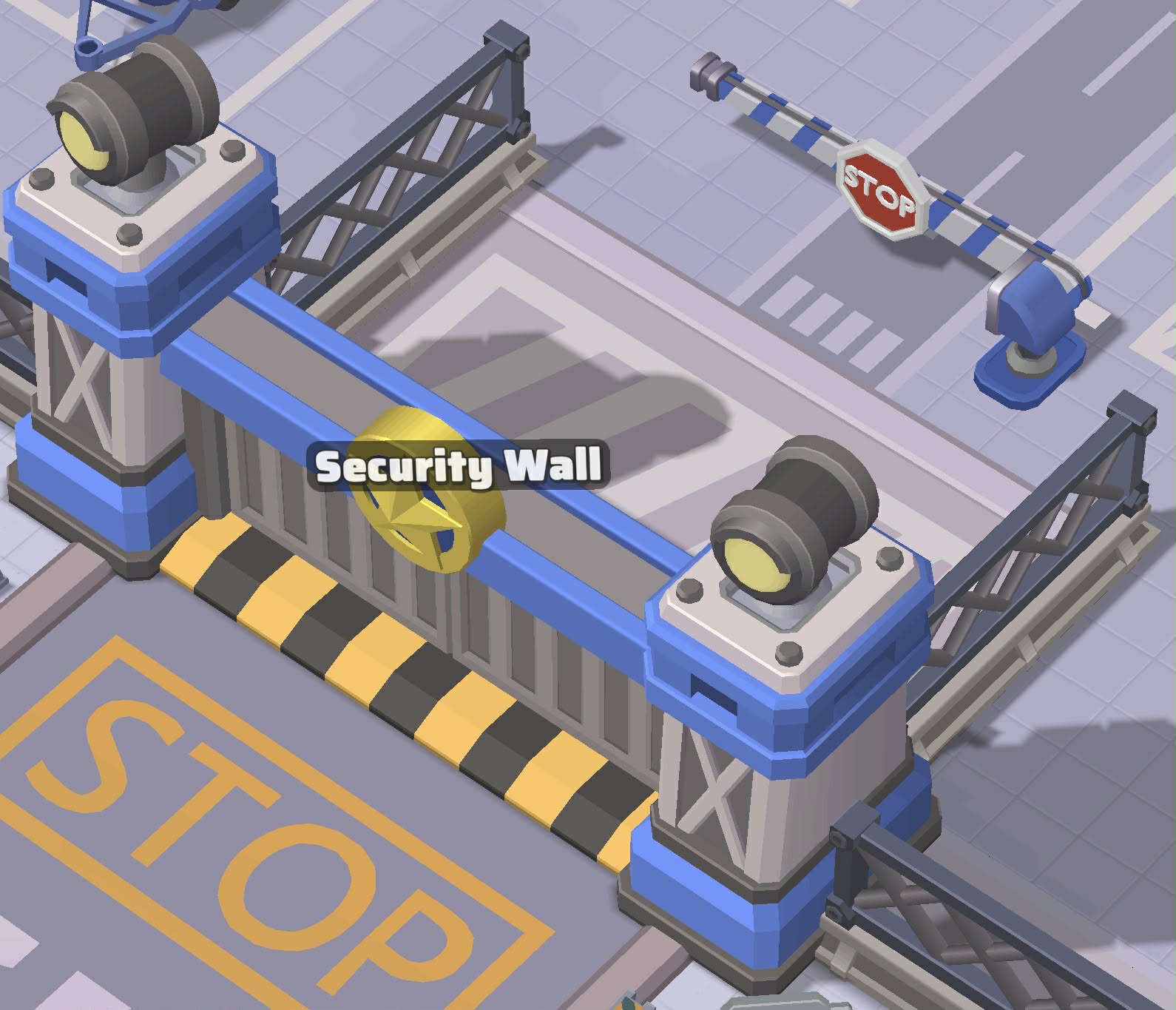The Security Wall with its two blue-and-grey towers and gold police emblem